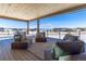 Relaxing deck with mountain views and comfortable seating at 2442 Fox View Trl, Franktown, CO 80116