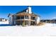 Luxury home exterior with stone and wood accents, a large deck at 2442 Fox View Trl, Franktown, CO 80116