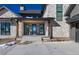 Inviting entryway with stone facade and double doors at 2442 Fox View Trl, Franktown, CO 80116
