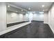 Basement gym with mirrored wall and rubber flooring at 2442 Fox View Trl, Franktown, CO 80116