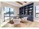 Spacious home office with built-in shelving and large windows at 2442 Fox View Trl, Franktown, CO 80116
