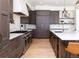 Modern kitchen with stainless steel appliances and an eat-in island at 2442 Fox View Trl, Franktown, CO 80116