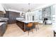 Open concept kitchen with island seating and views into the great room at 2442 Fox View Trl, Franktown, CO 80116