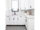 Laundry room with ample counterspace, black and white accents, and floral-patterned flooring at 2442 Fox View Trl, Franktown, CO 80116