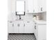 Bright laundry room with white cabinets and patterned floor at 2442 Fox View Trl, Franktown, CO 80116