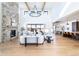 Spacious living room with vaulted ceilings, stone fireplace, and an open concept design for modern living at 2442 Fox View Trl, Franktown, CO 80116