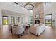 Elegant living room featuring a stone fireplace and ample seating at 2442 Fox View Trl, Franktown, CO 80116