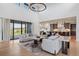 Open-concept living area that flows into the kitchen, with hardwood floors at 2442 Fox View Trl, Franktown, CO 80116