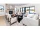 Cozy living room featuring a stone fireplace and ample seating at 2442 Fox View Trl, Franktown, CO 80116