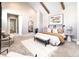 Main bedroom with vaulted ceilings and large windows at 2442 Fox View Trl, Franktown, CO 80116