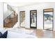 Modern staircase with metal railing and light wood steps at 2442 Fox View Trl, Franktown, CO 80116