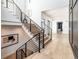 Modern light-wood staircase with metal railings at 2442 Fox View Trl, Franktown, CO 80116