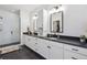 Spacious bathroom with double sinks, vanity, walk-in shower and modern fixtures at 10165 E 59Th Ave, Denver, CO 80238