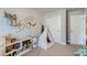 Charming bedroom with a teepee play area and ample closet space at 16057 E 47Th Pl, Denver, CO 80239