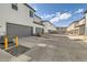 View of private garages and parking area at 16057 E 47Th Pl, Denver, CO 80239