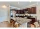 Modern kitchen with granite countertops and dark cabinets at 16057 E 47Th Pl, Denver, CO 80239