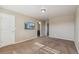 Neutral bedroom with a flatscreen TV and view into the en-suite bathroom area at 42311 Forest Oaks Dr, Elizabeth, CO 80107