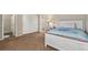 Comfortable bedroom with a plush bed, closet, and a glimpse into an adjacent bathroom, offering a serene retreat at 42311 Forest Oaks Dr, Elizabeth, CO 80107