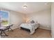 Cozy bedroom with a single bed, side table, and neutral walls at 42311 Forest Oaks Dr, Elizabeth, CO 80107