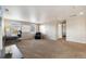 Expansive bonus room offers versatile space, flooded with natural light from multiple windows and plush carpeting at 42311 Forest Oaks Dr, Elizabeth, CO 80107