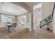 Open-concept view from the dining room showcases seamless flow into the living area, enhancing the home's spaciousness at 42311 Forest Oaks Dr, Elizabeth, CO 80107