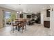 Stylish kitchen with dark cabinetry, granite countertops, stainless steel appliances, and a cozy breakfast nook at 42311 Forest Oaks Dr, Elizabeth, CO 80107