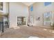 Open-concept living room with high ceilings flowing seamlessly into the adjacent dining area, offering spacious living at 42311 Forest Oaks Dr, Elizabeth, CO 80107