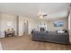 Spacious living room featuring neutral tones, a fireplace, and a comfortable gray sectional sofa at 42311 Forest Oaks Dr, Elizabeth, CO 80107