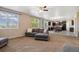 Open-concept living room seamlessly connects to a modern kitchen, offering versatile living space at 42311 Forest Oaks Dr, Elizabeth, CO 80107