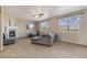 Bright living room with large windows, fireplace, and comfortable seating, perfect for relaxation and entertaining at 42311 Forest Oaks Dr, Elizabeth, CO 80107