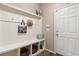 Inviting mudroom features a convenient bench with storage, perfect for organization and a welcoming transition at 42311 Forest Oaks Dr, Elizabeth, CO 80107