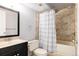 Full bathroom with shower and tub, vanity sink, and toilet at 7883 S Windermere Cir, Littleton, CO 80120