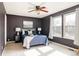 Bedroom with windows, ceiling fan, and carpet at 7883 S Windermere Cir, Littleton, CO 80120