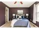 Bedroom with windows, ceiling fan, and carpet at 7883 S Windermere Cir, Littleton, CO 80120