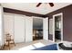 Bedroom with closet, bathroom, and windows at 7883 S Windermere Cir, Littleton, CO 80120