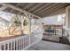Covered patio features a swing and view to the fenced yard at 7883 S Windermere Cir, Littleton, CO 80120