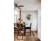 Dining room features a wood table, chairs, and wood floors at 7883 S Windermere Cir, Littleton, CO 80120