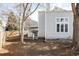 Back exterior view with a covered patio at 7883 S Windermere Cir, Littleton, CO 80120