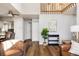 Open concept living area featuring hardwood floors, and a view into the kitchen at 7883 S Windermere Cir, Littleton, CO 80120