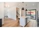 Bright, modern kitchen with a large island, stainless steel appliances, and access to the outdoor patio at 3649 W 21St Ave, Denver, CO 80211