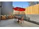 Outdoor patio features a red umbrella and seating, perfect for entertaining or relaxing in style at 3649 W 21St Ave, Denver, CO 80211