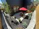 Charming backyard featuring a patio, dining table, garden, and string lights, perfect for outdoor relaxation at 3649 W 21St Ave, Denver, CO 80211