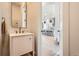 Bright bathroom featuring a modern vanity and tile backsplash at 3649 W 21St Ave, Denver, CO 80211