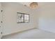 Bright bedroom featuring a modern light fixture, a large window and neutral decor at 3649 W 21St Ave, Denver, CO 80211
