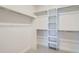 A walk-in closet with white shelving and metal clothing racks for ample storage at 3649 W 21St Ave, Denver, CO 80211