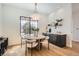 Bright dining room featuring a round table, a modern chandelier, and a built-in sideboard at 3649 W 21St Ave, Denver, CO 80211