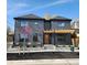Elegant home with a modern pergola, meticulous landscaping, and an eye-catching door at 3649 W 21St Ave, Denver, CO 80211