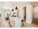 Beautiful kitchen with white cabinets and an island with stools at 3649 W 21St Ave, Denver, CO 80211