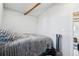 Bedroom with slanted ceilings and exposed beam, furnished with comfortable bedding at 422 Atwood St, Longmont, CO 80501