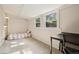 Light filled bedroom with carpet, twin bed, desk, and ample natural light at 422 Atwood St, Longmont, CO 80501